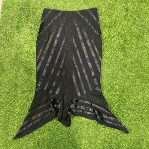 Ladies black flair skirt with satin stripes and lace detailing.